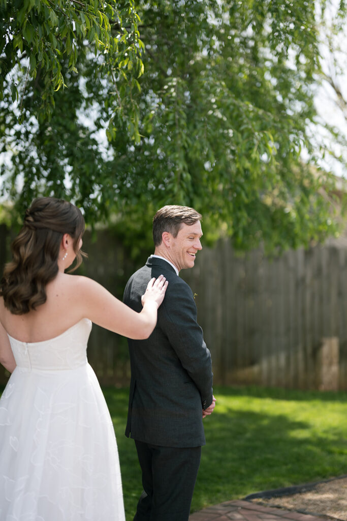 Bride and groom sharing an outdoor first look at The Bunn House in Asheville, North Carolina