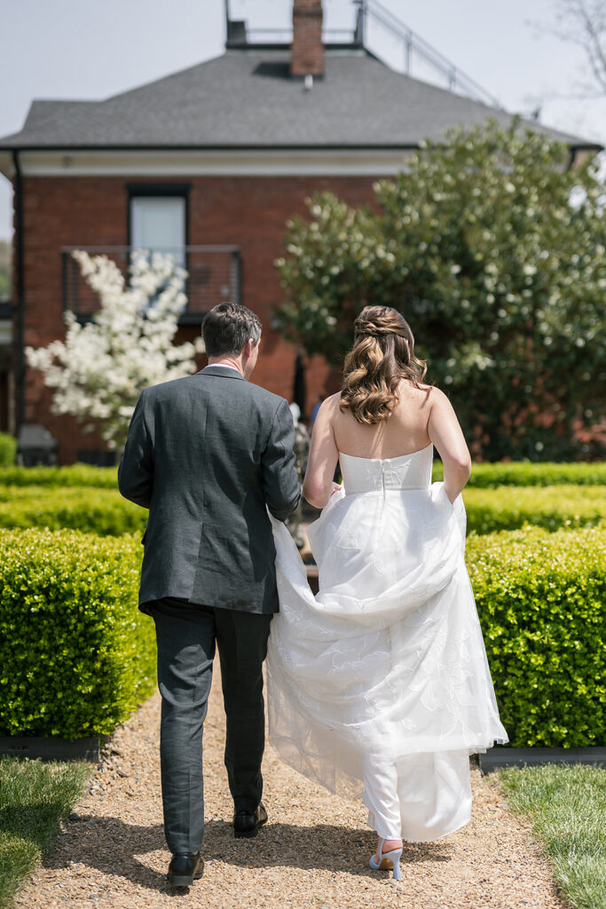 Bride and groom walking back to The Bunn House in Asheville, North Carolina