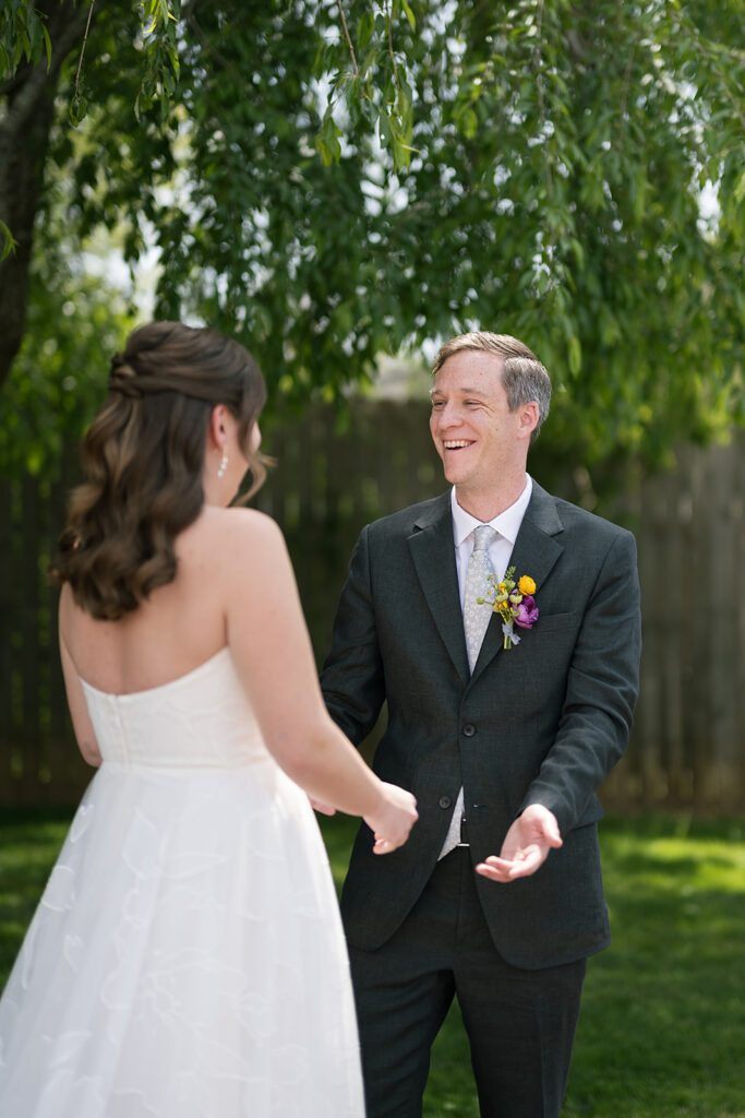 Bride and groom sharing an outdoor first look at The Bunn House in Asheville, North Carolina