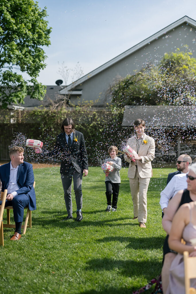 Bubble boys blowing bubbles before the bride walks down the aisle