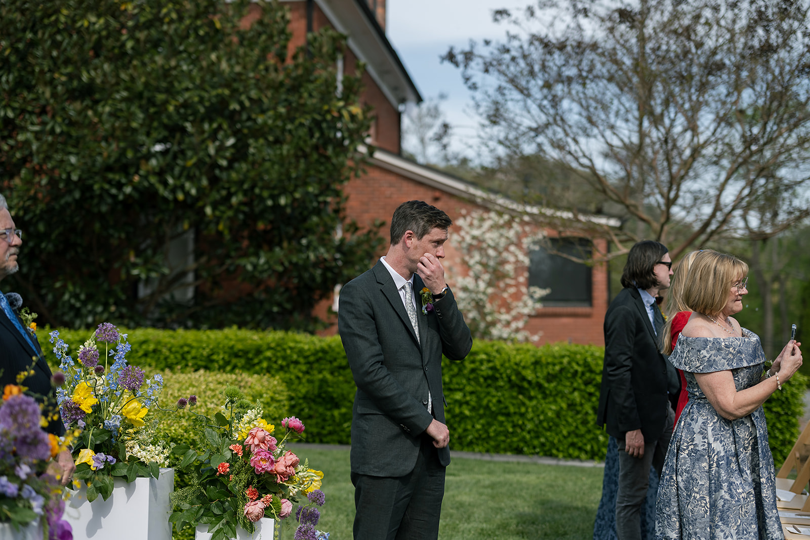 Groom wiping away tears as bride walks down the aisle at intimate Asheville micro wedding