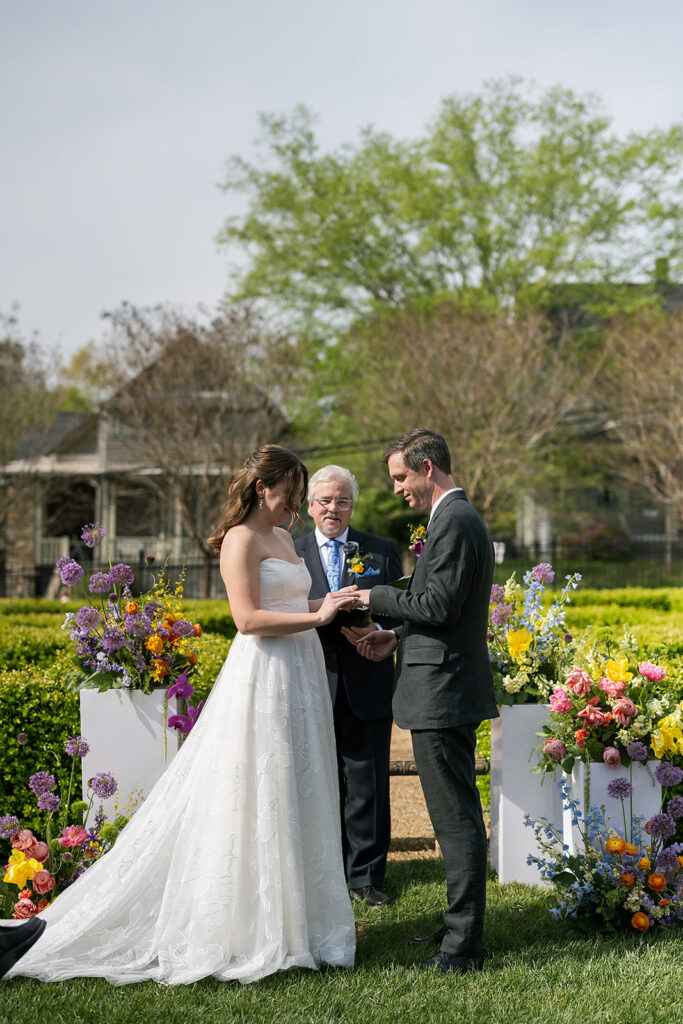 Bride and groom exchanging their rings
