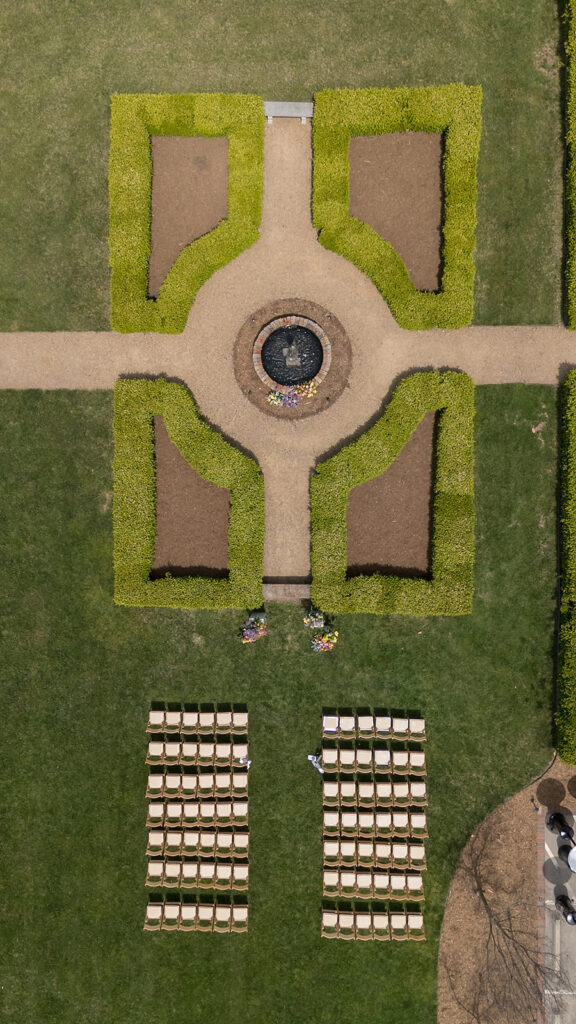 Overhead drone shot of an intimate outdoor Asheville micro wedding ceremony at The Bunn House