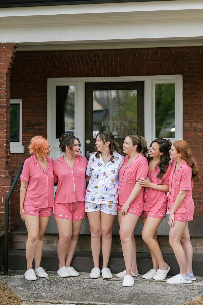 Outdoor bride and bridesmaids posing in their pajamas at The Bunn House