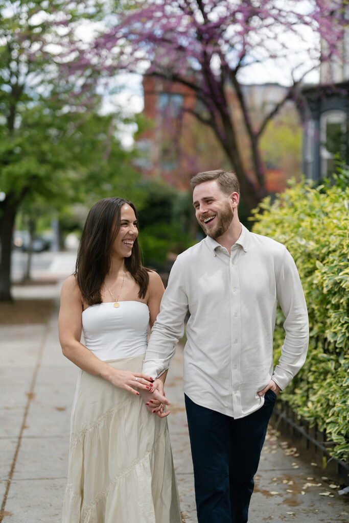 Couple walking the sidewalks for their Washington DC engagement photos