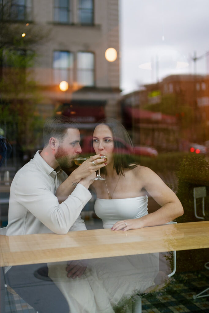 Couple having drinks at Jane Jane for their engagement photos in Washington DC