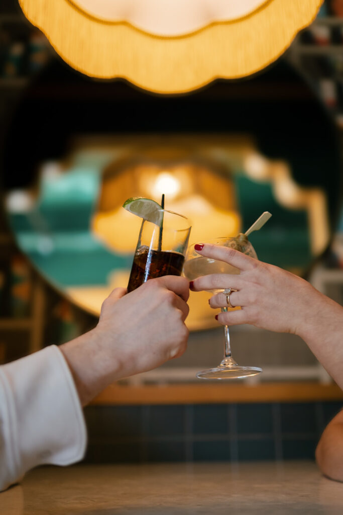 Couple toasting with their drinks