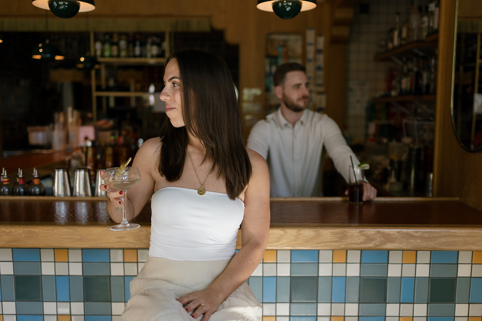Editorial engagement photos of a couple posing at Jane Jane