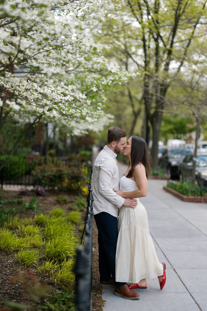 Couple kissing on the sidewalks of Washington DC