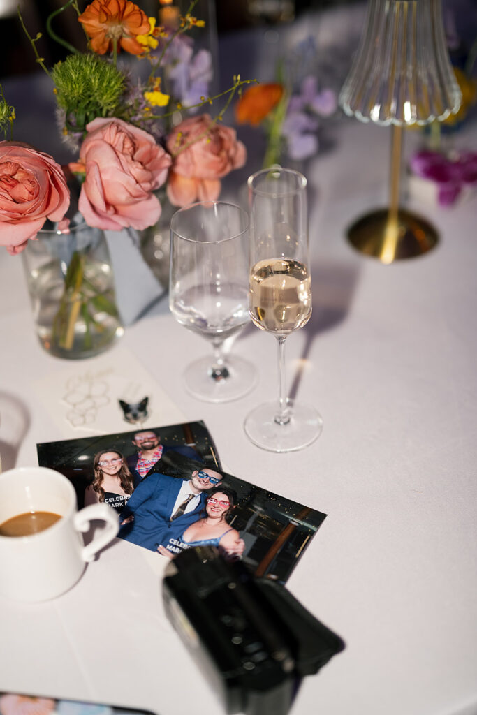 Wedding reception detail shot with photos, coffee, and champagne