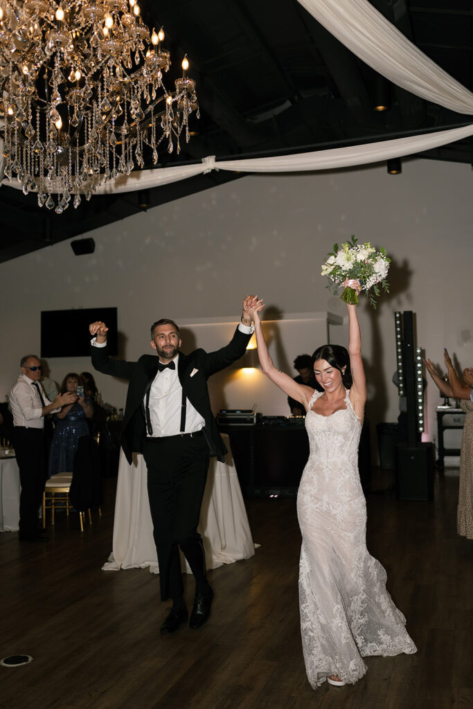 Bride and groom entering the reception
