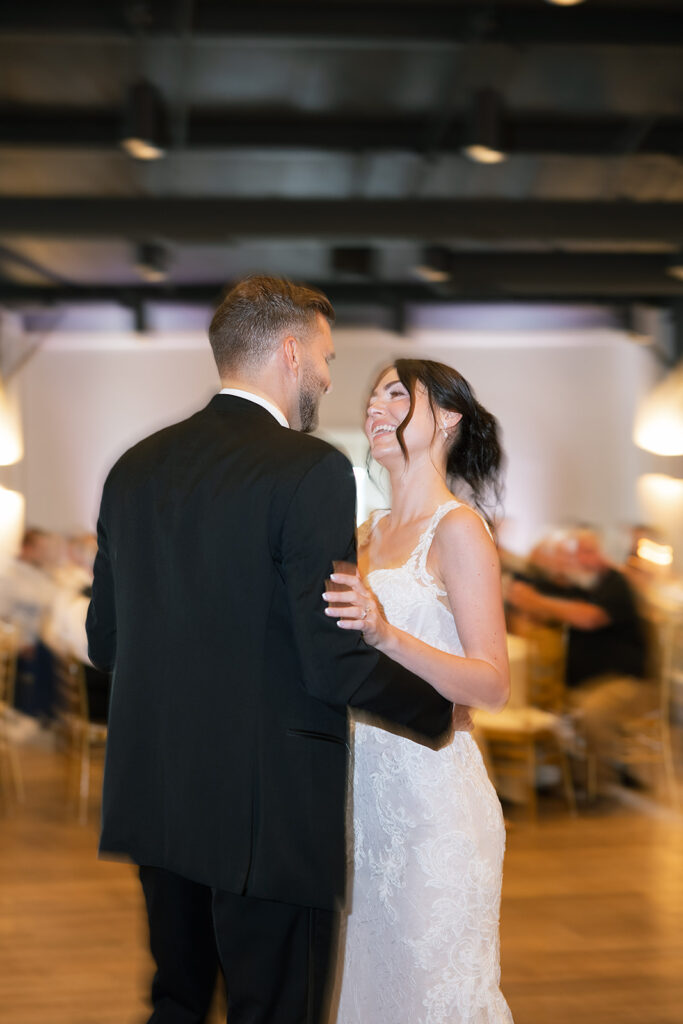 Bride and groom dancing during their Daniel's Vineyard wedding reception in the Upper Ballroom