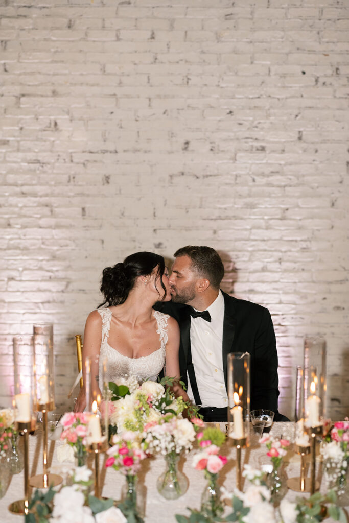 Bride and groom kissing during their Daniel's Vineyard wedding reception