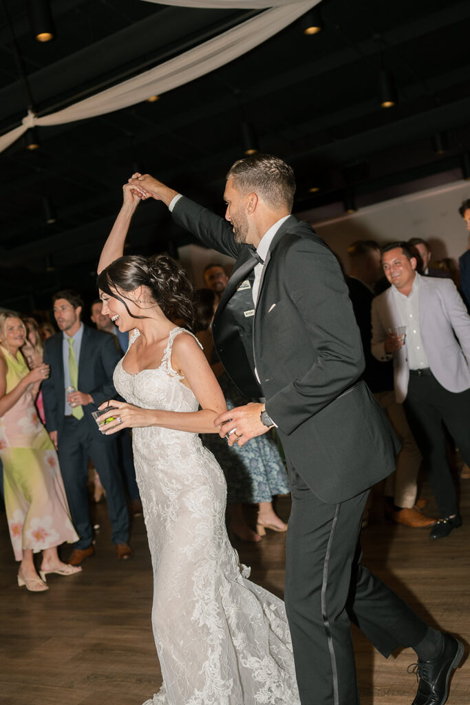 Groom and bride dancing during the reception