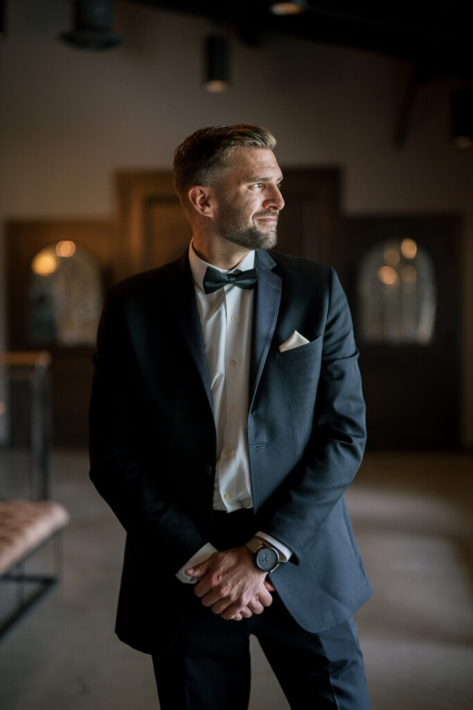 Indoor grooms portraits at Daniel's Vineyard wedding venue