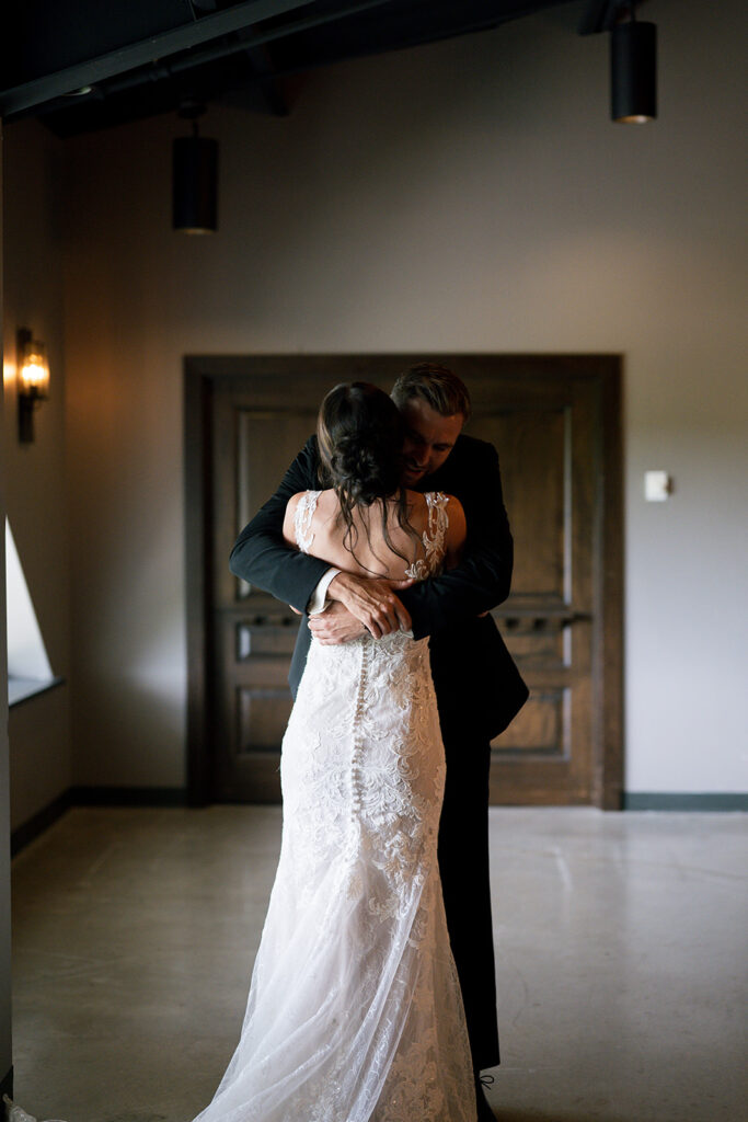 Bride and groom jugging after sharing a first look