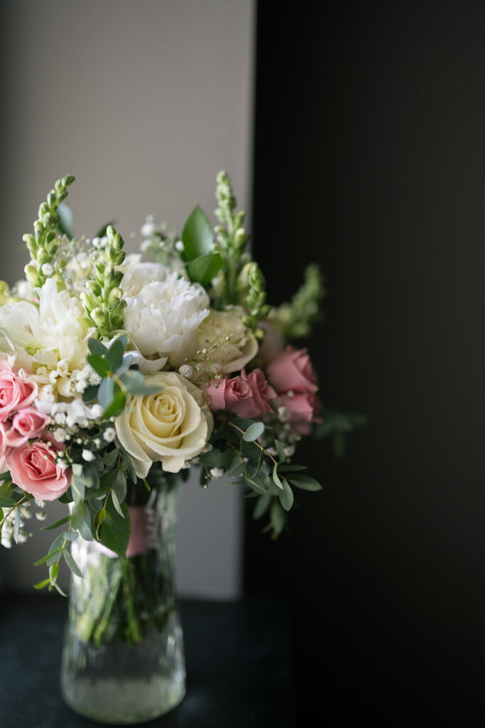 Brides wedding bouquet in a vase of water
