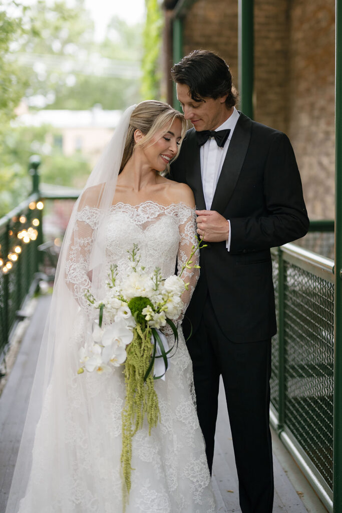 Bride and groom posing at Chicago Firehouse for their micro wedding portraits