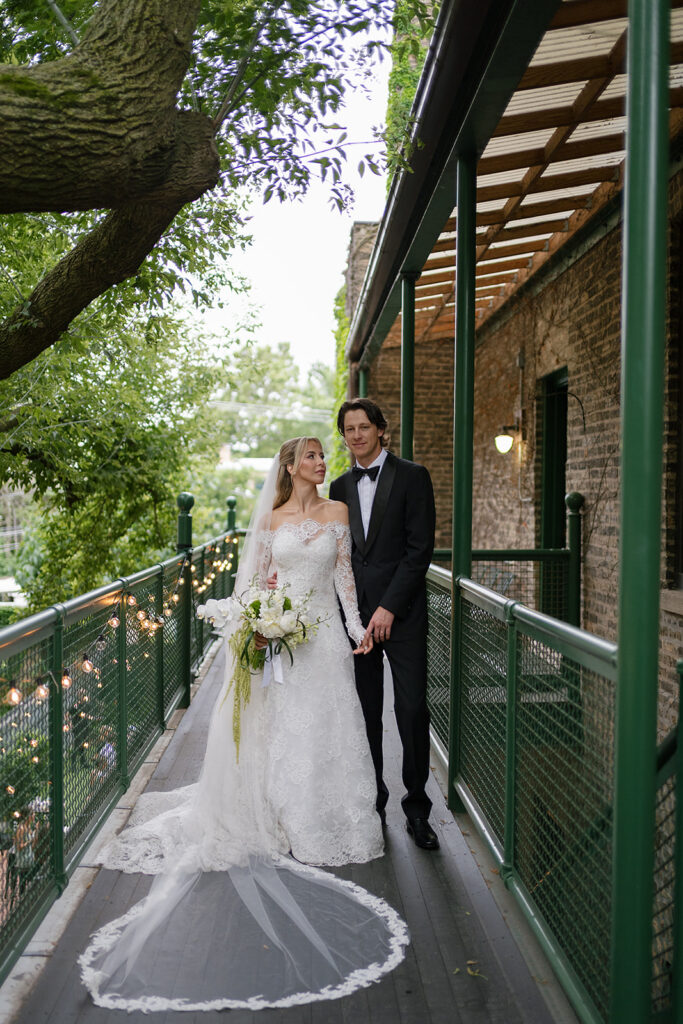 Editorial bride and grooms portraits on the balcony at Chicago Firehouse micro wedding venue