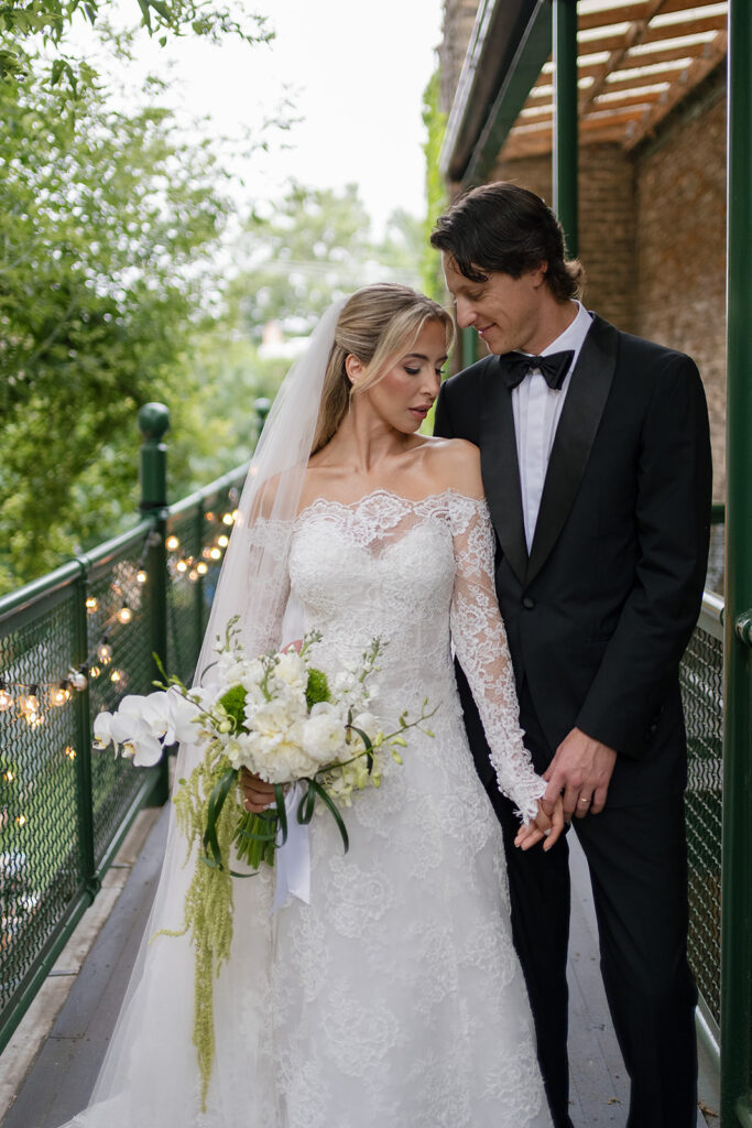 Editorial bride and grooms portraits on the balcony at Chicago Firehouse micro wedding venue