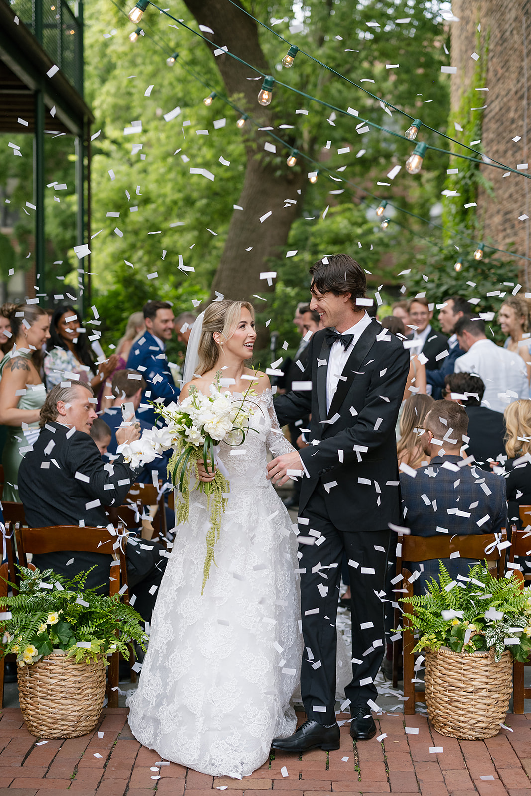 Bride and groom walking back down the aisle as husband and wife after their Chicago Firehouse micro wedding ceremony