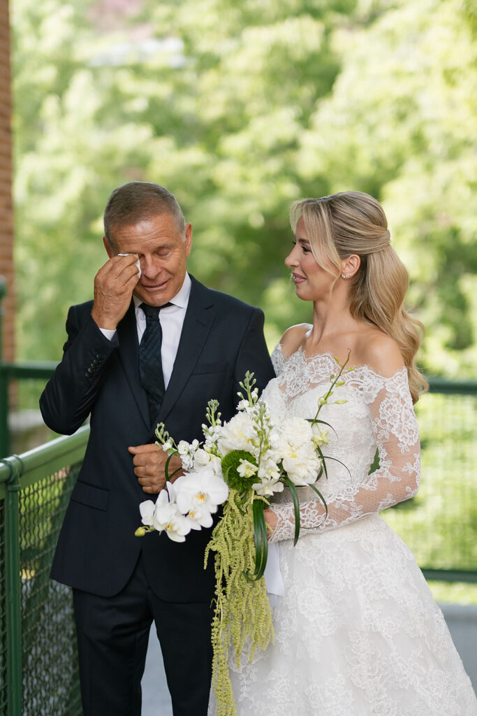 Father of the bride getting emotional after sharing a first look with the bride