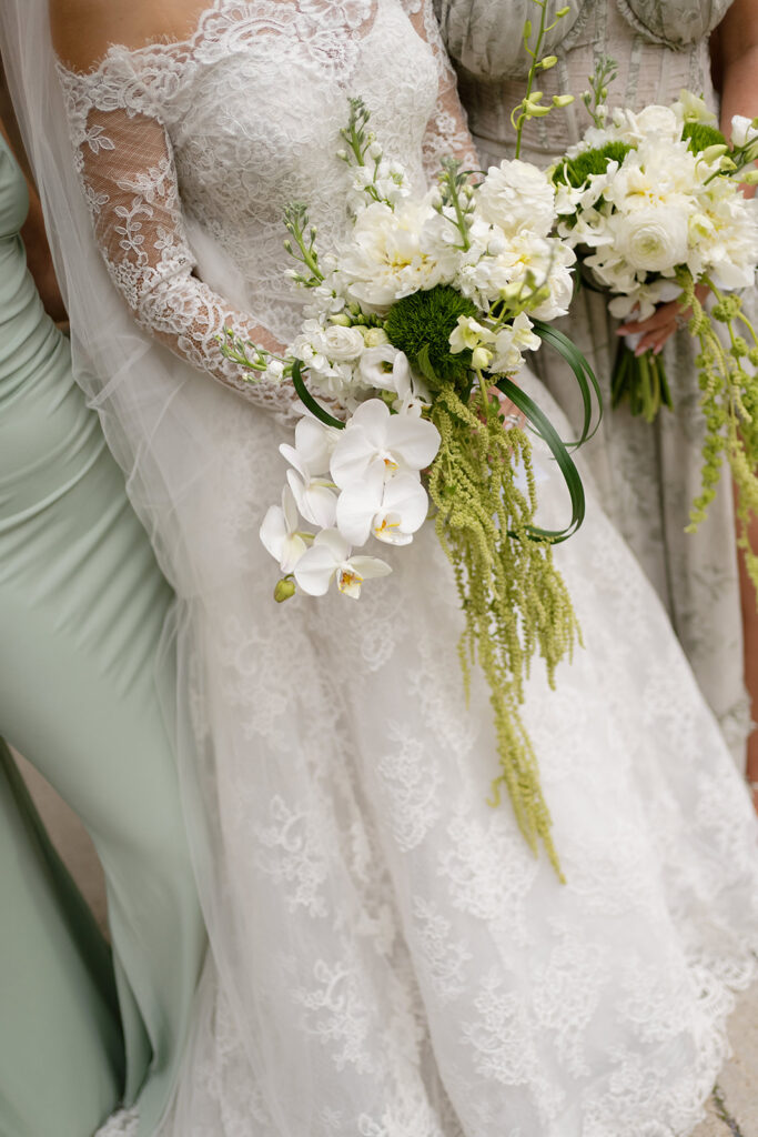Close up shot of a bride and her bridesmaids holding bouquets